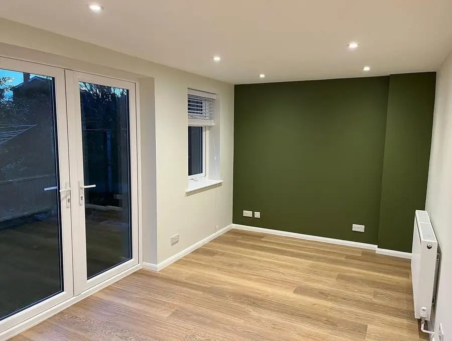 Newly decorated room with recessed downlights and new sockets