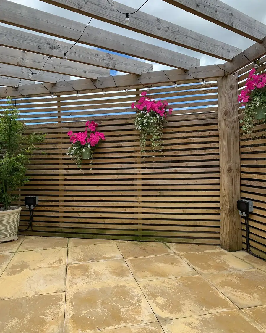 Garden pergola with festoon lighting and outdoor weatherproof sockets